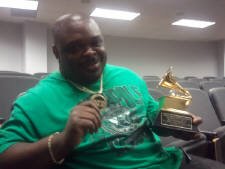 DJ.D chillen after Mathew Knowles class holding Beyonce's first grammy